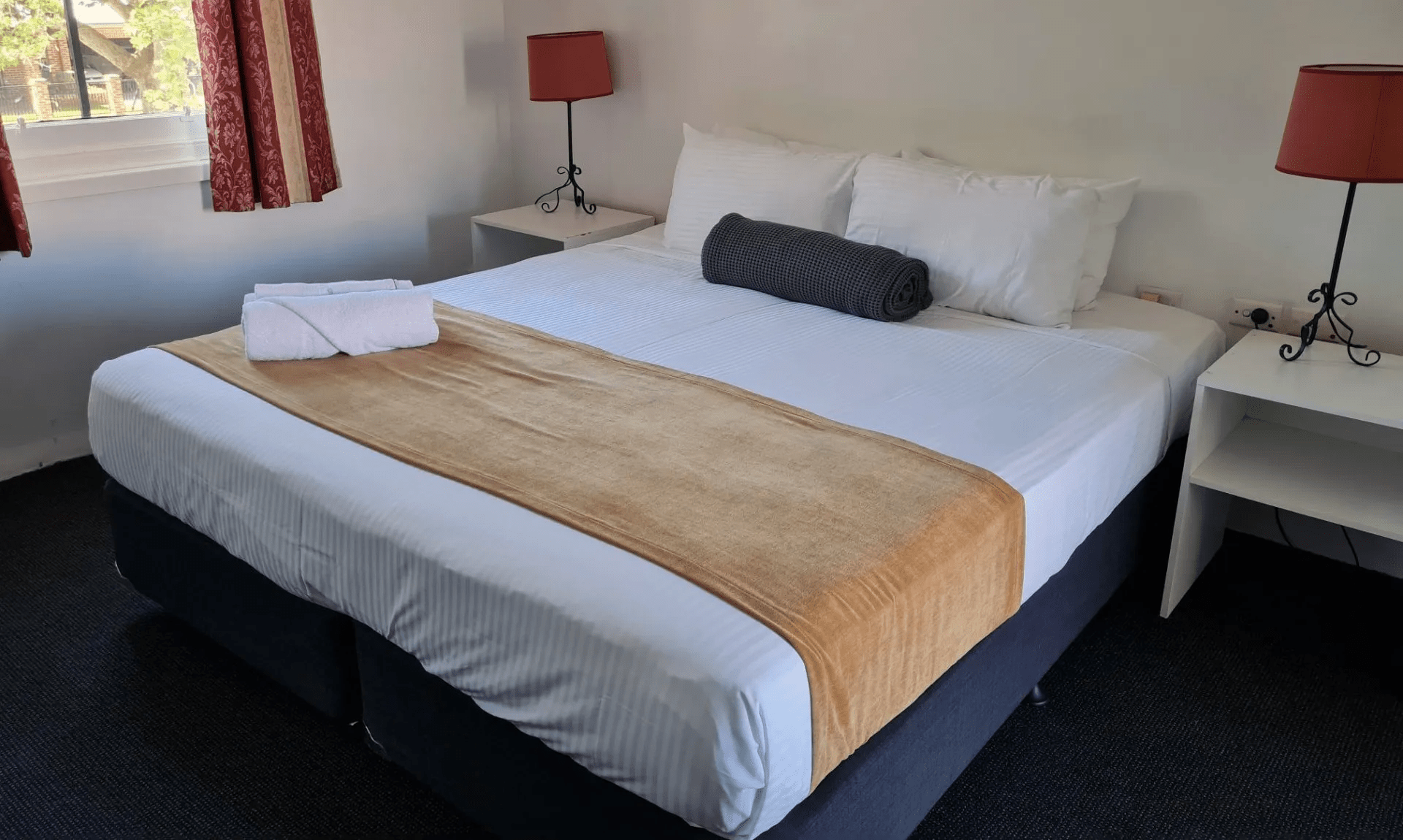1 Bedroom Family Room offering a king bed and two single beds